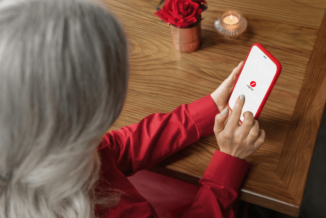 Woman using Signia app