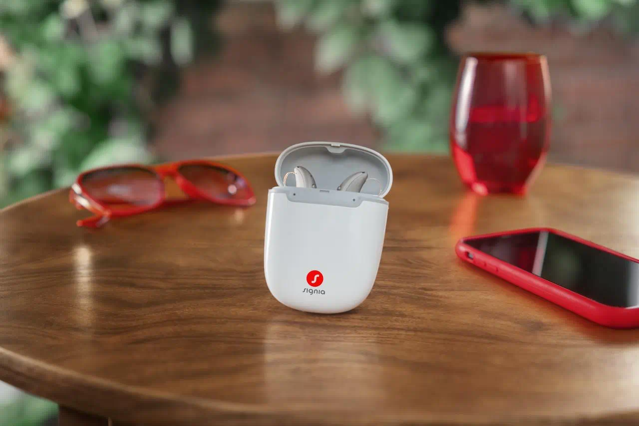 Signia MaX hearing aid in the charger