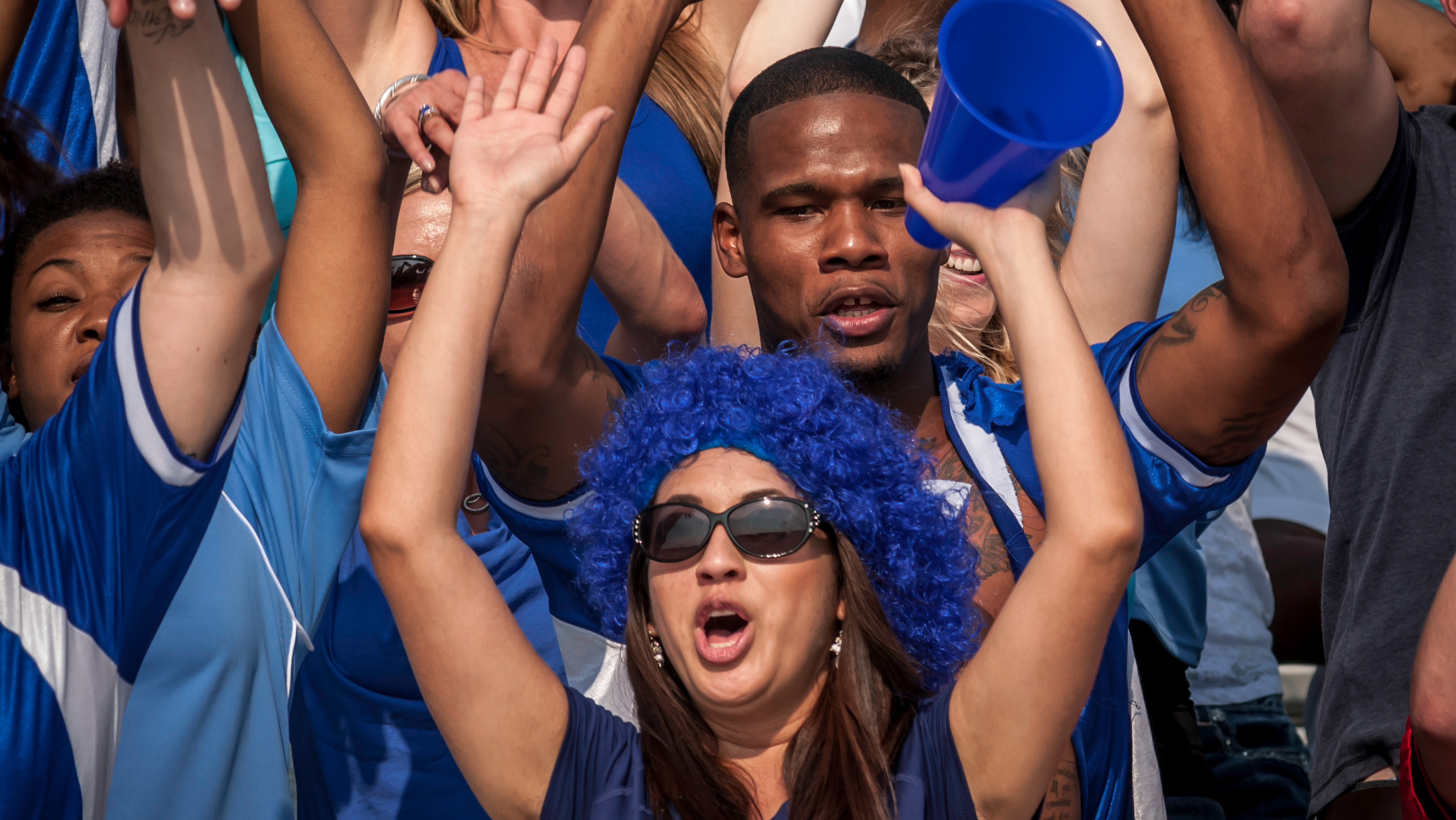 Crowd cheering, where someone with hearing loss finds it hard to distinguish sounds.