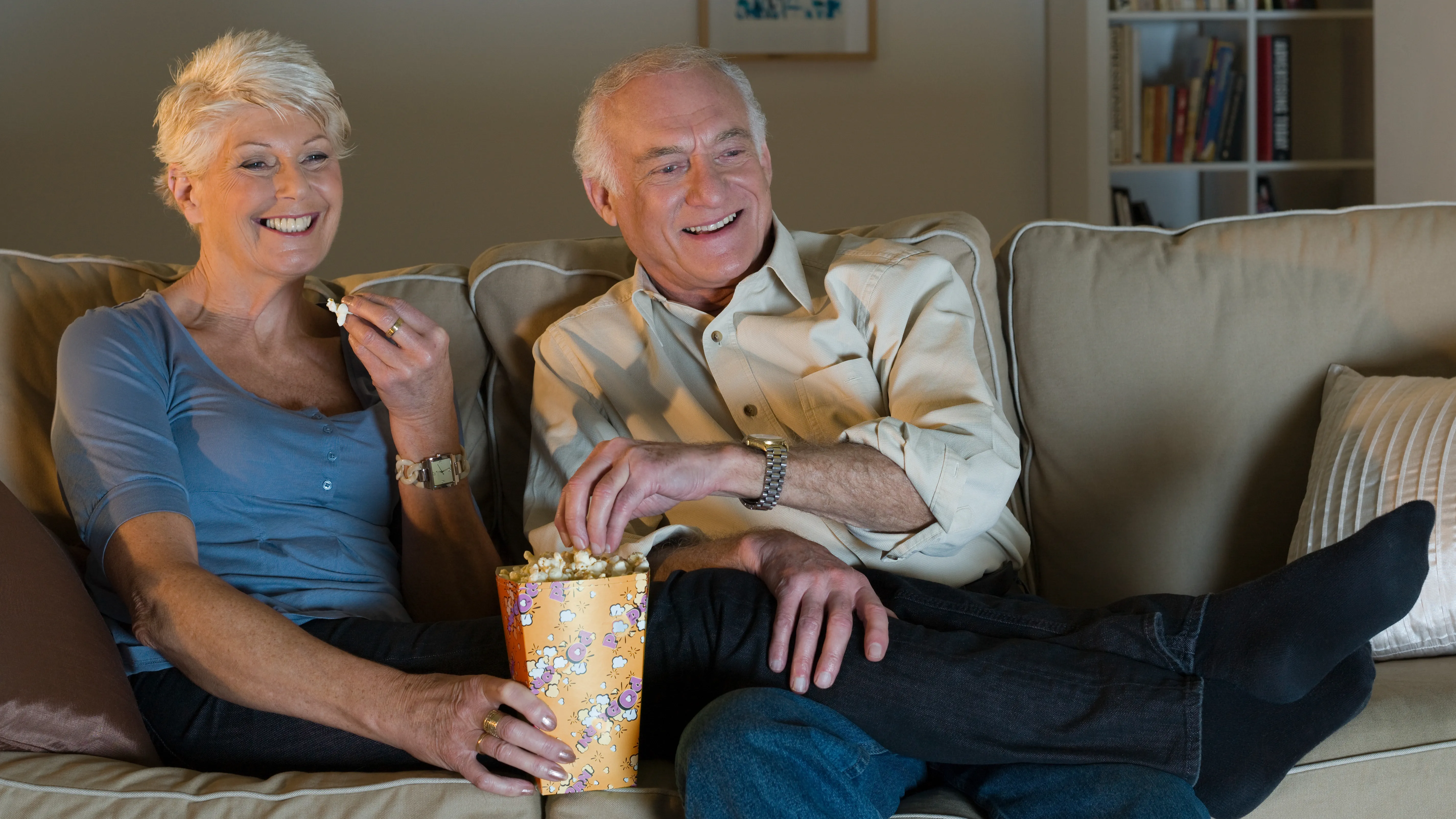 elderly couple watching tv