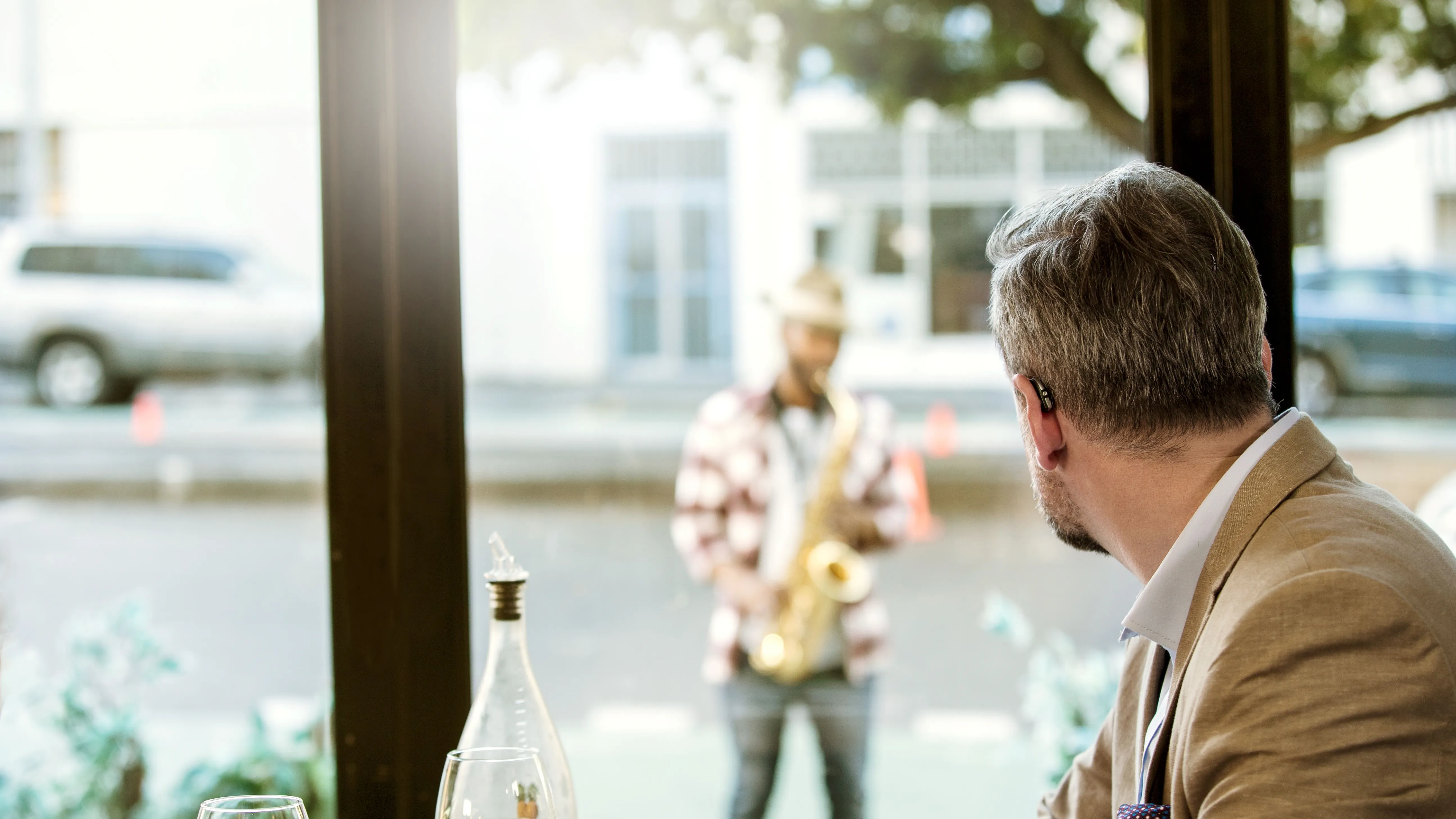 man starring outside the window