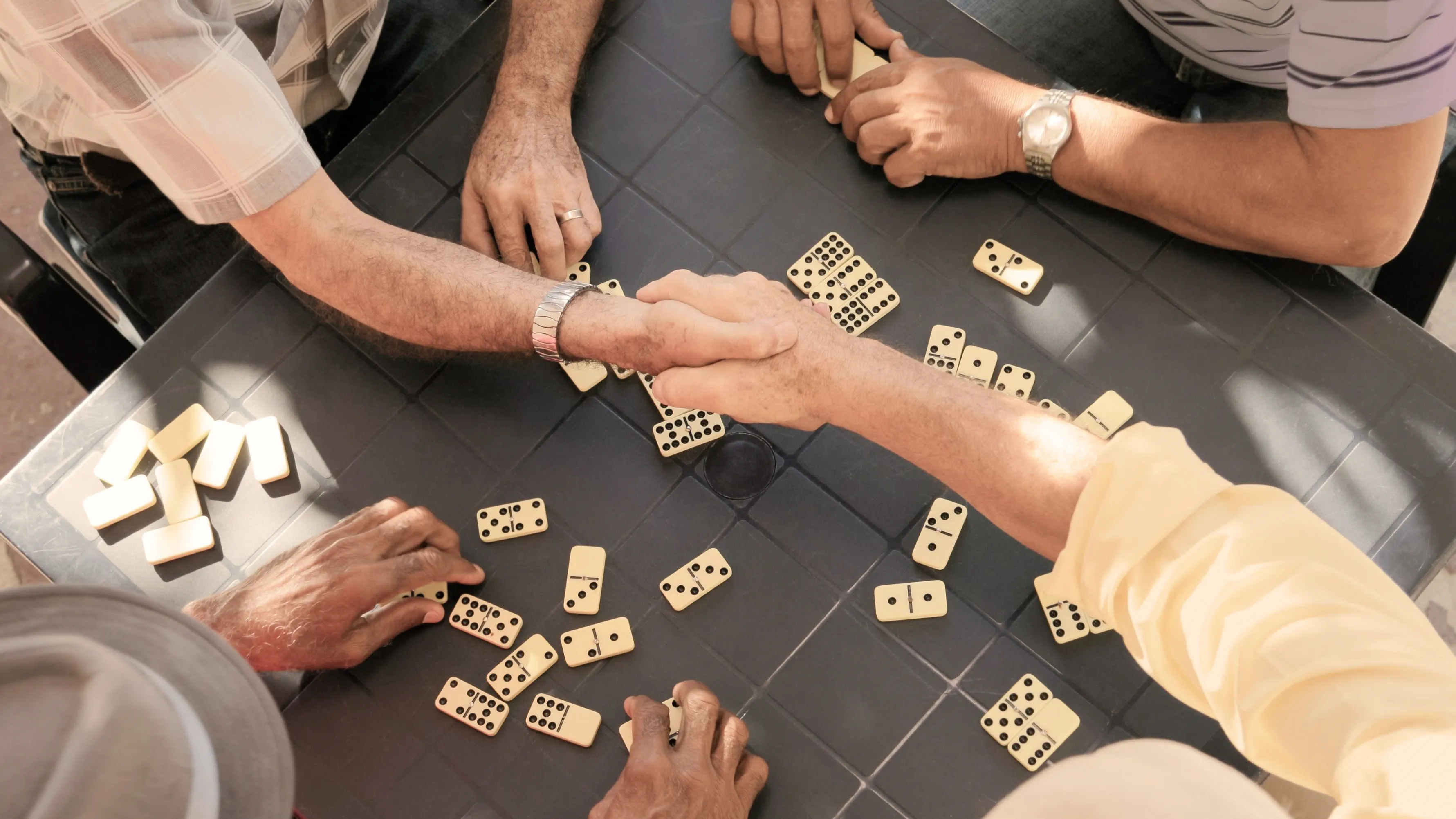 Friends playing a game, where one friend struggles to hear instructions because of hearing loss.