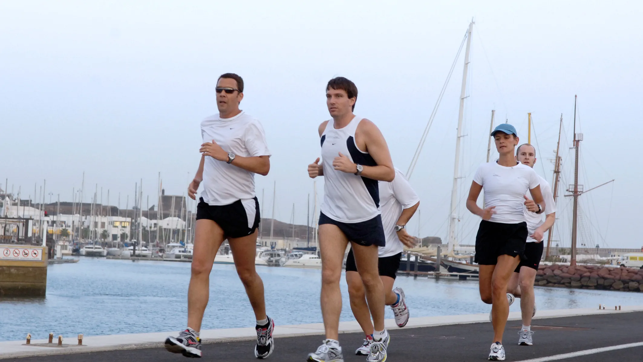 Jogging near the docks, struggling to hear the environment because of hearing loss.
