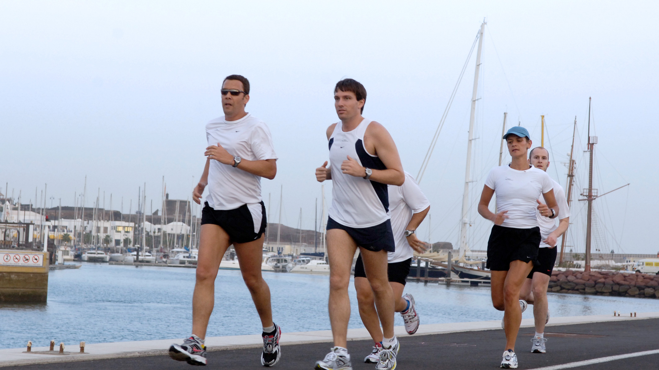 Jogging near the docks, struggling to hear the environment because of hearing loss.
