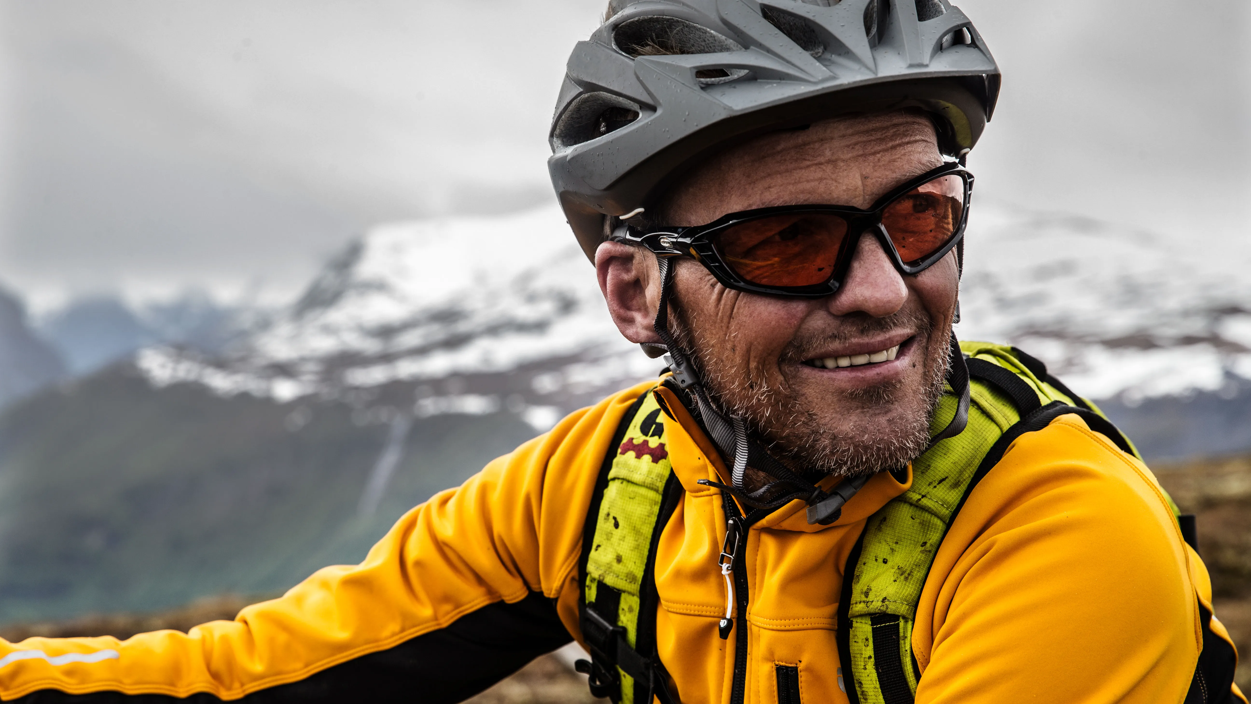 A man wearing hearing aids on a bicycle