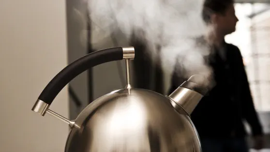Tea kettle boiling over creating a high pitched sound risking hearing loss. 