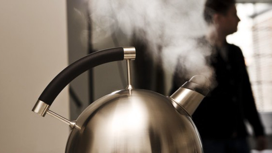 Tea kettle boiling over creating a high pitched sound risking hearing loss. 