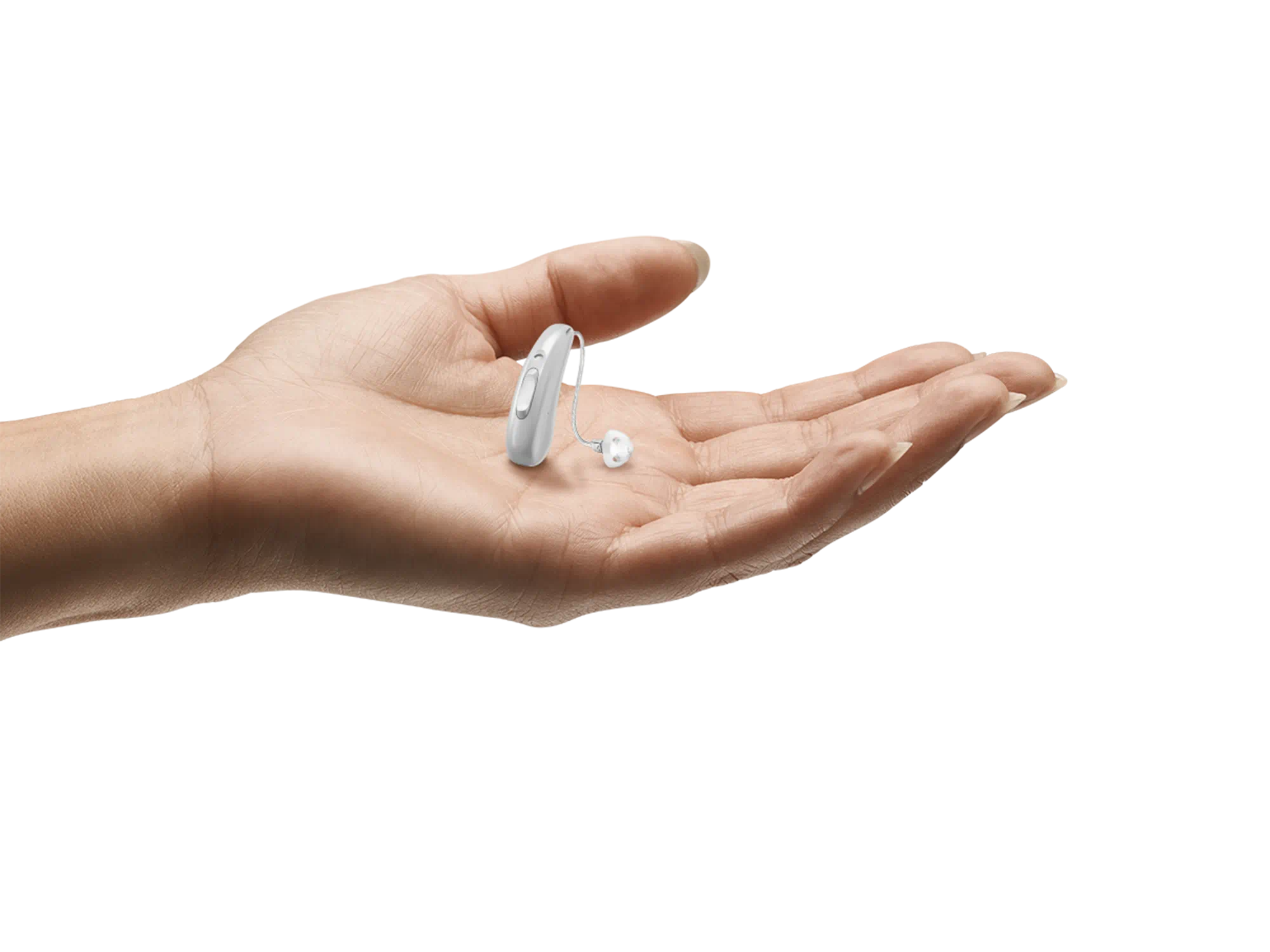 Hearing aid held in hand to show how tiny it is.