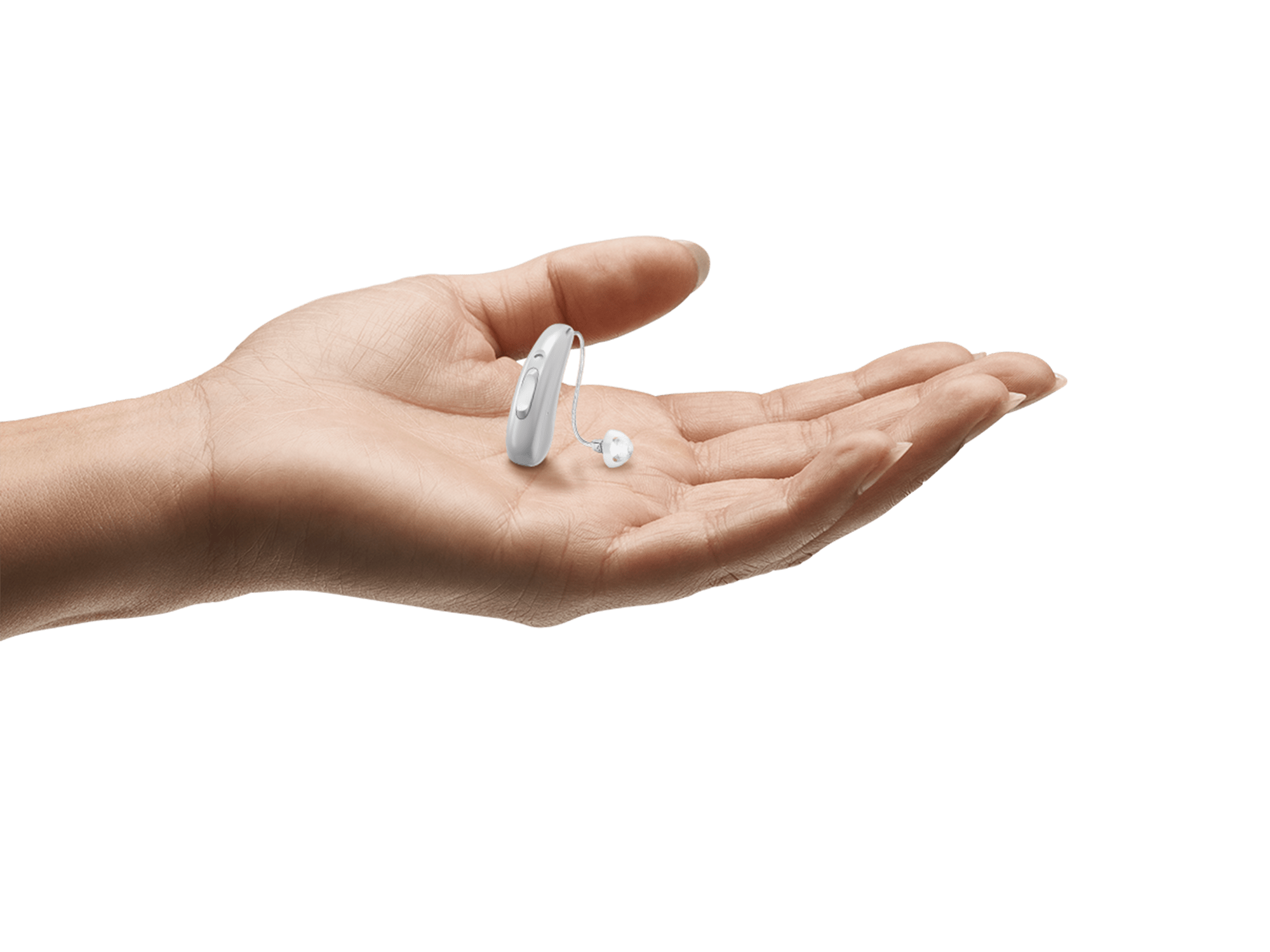 Hearing aid held in hand to show how tiny it is.