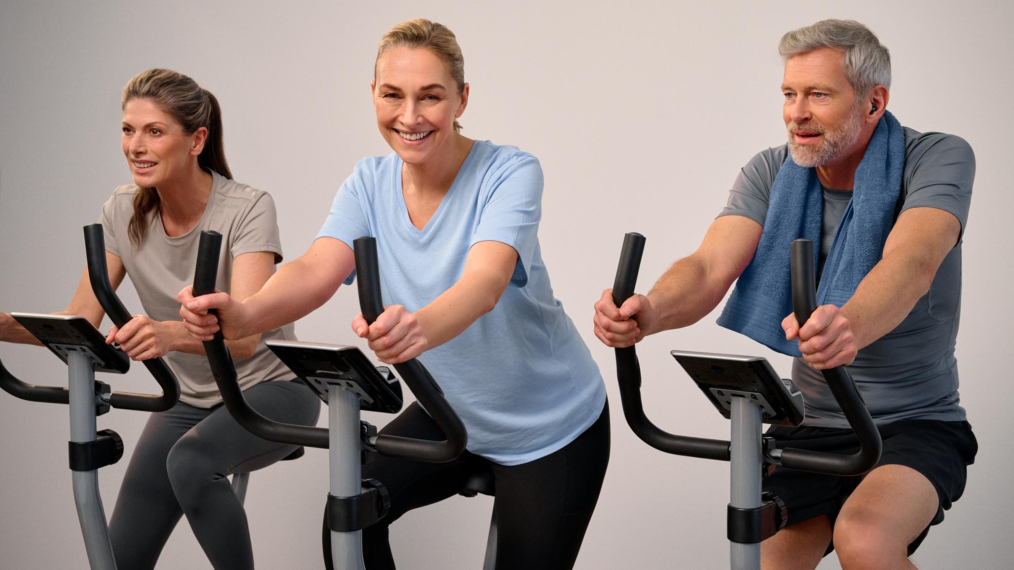 Active friends biking, showing hearing improvement.