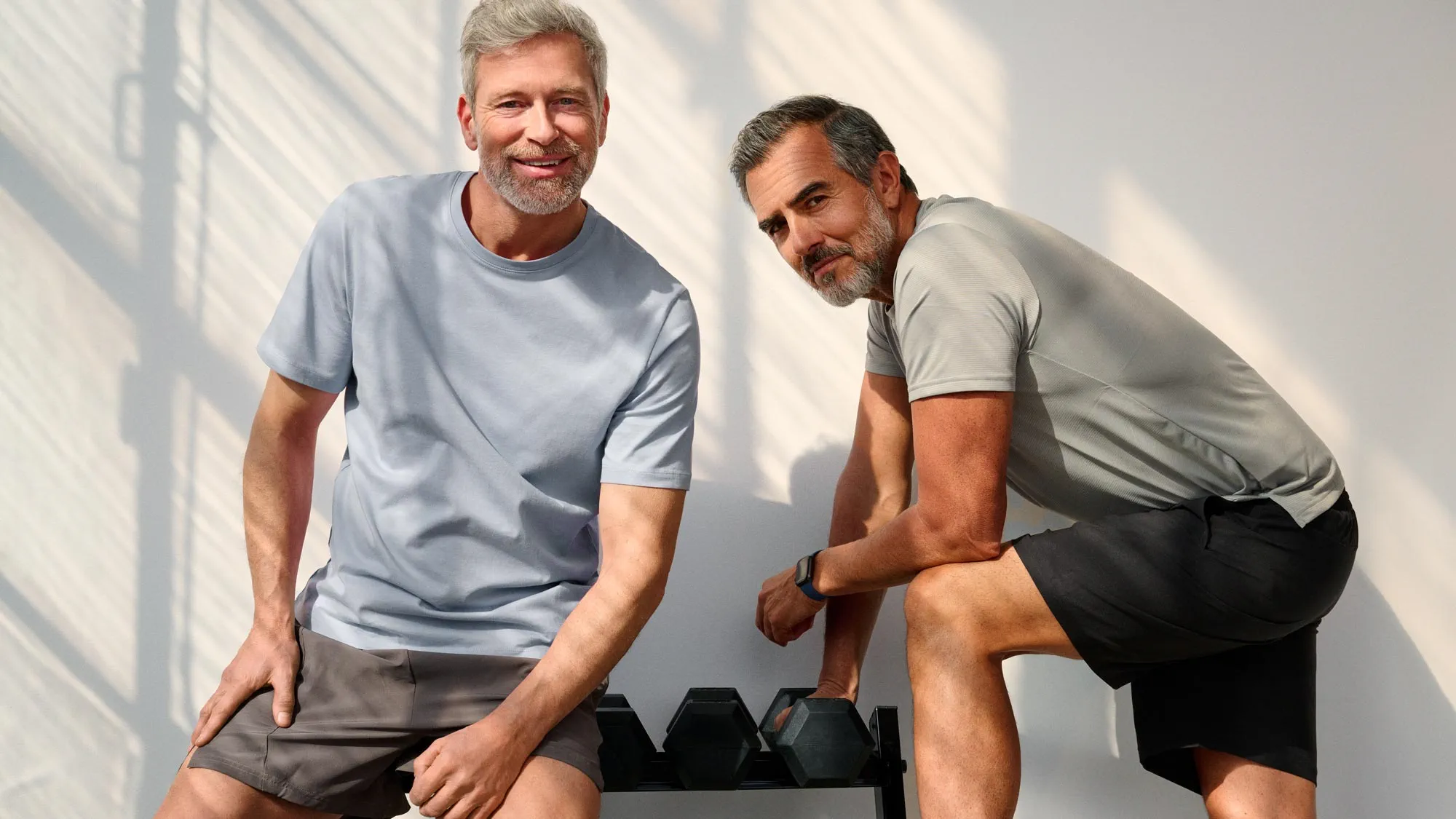 Friends in the gym staring, all wearing hearing aids.