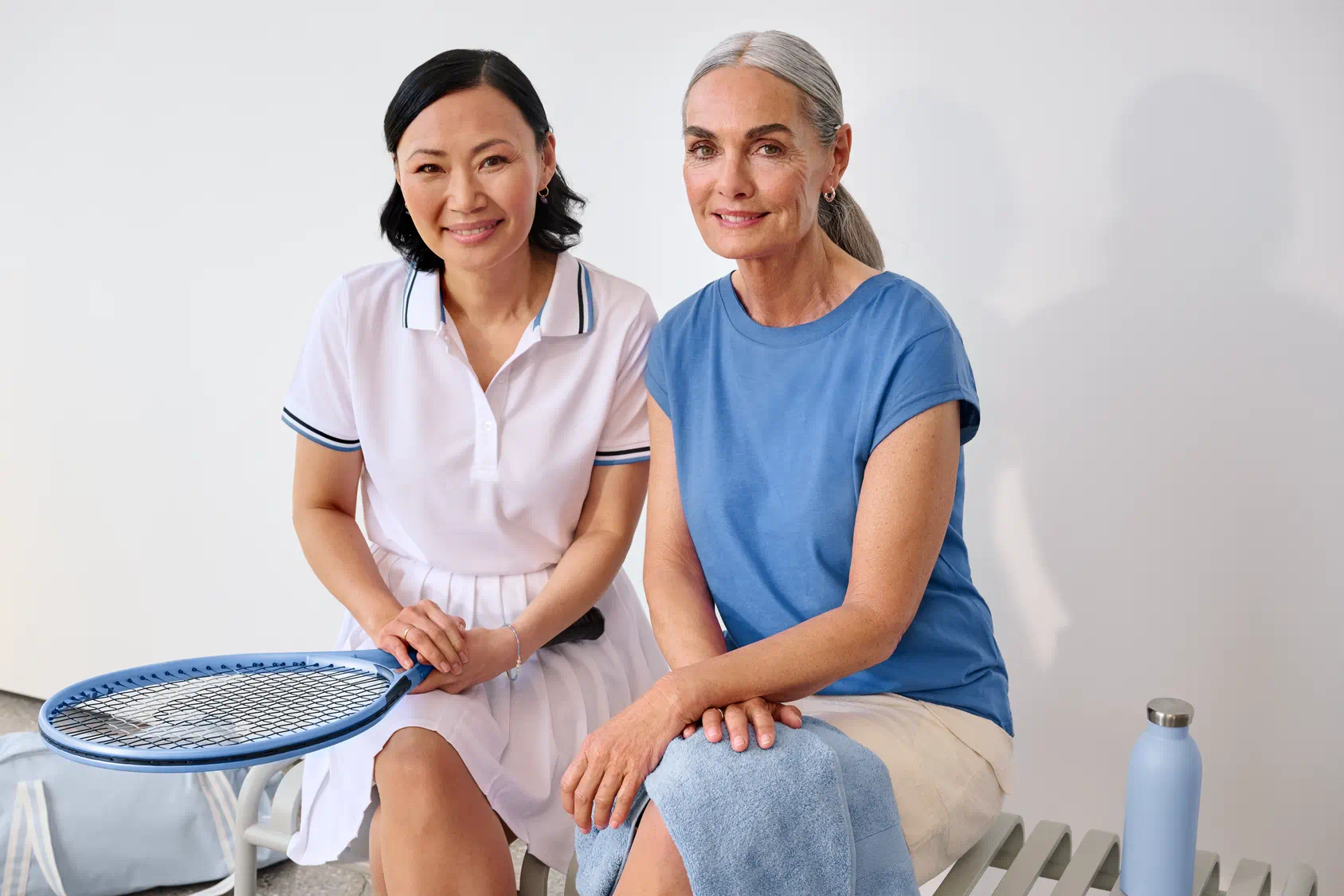 women sitting down tennis hearing aid