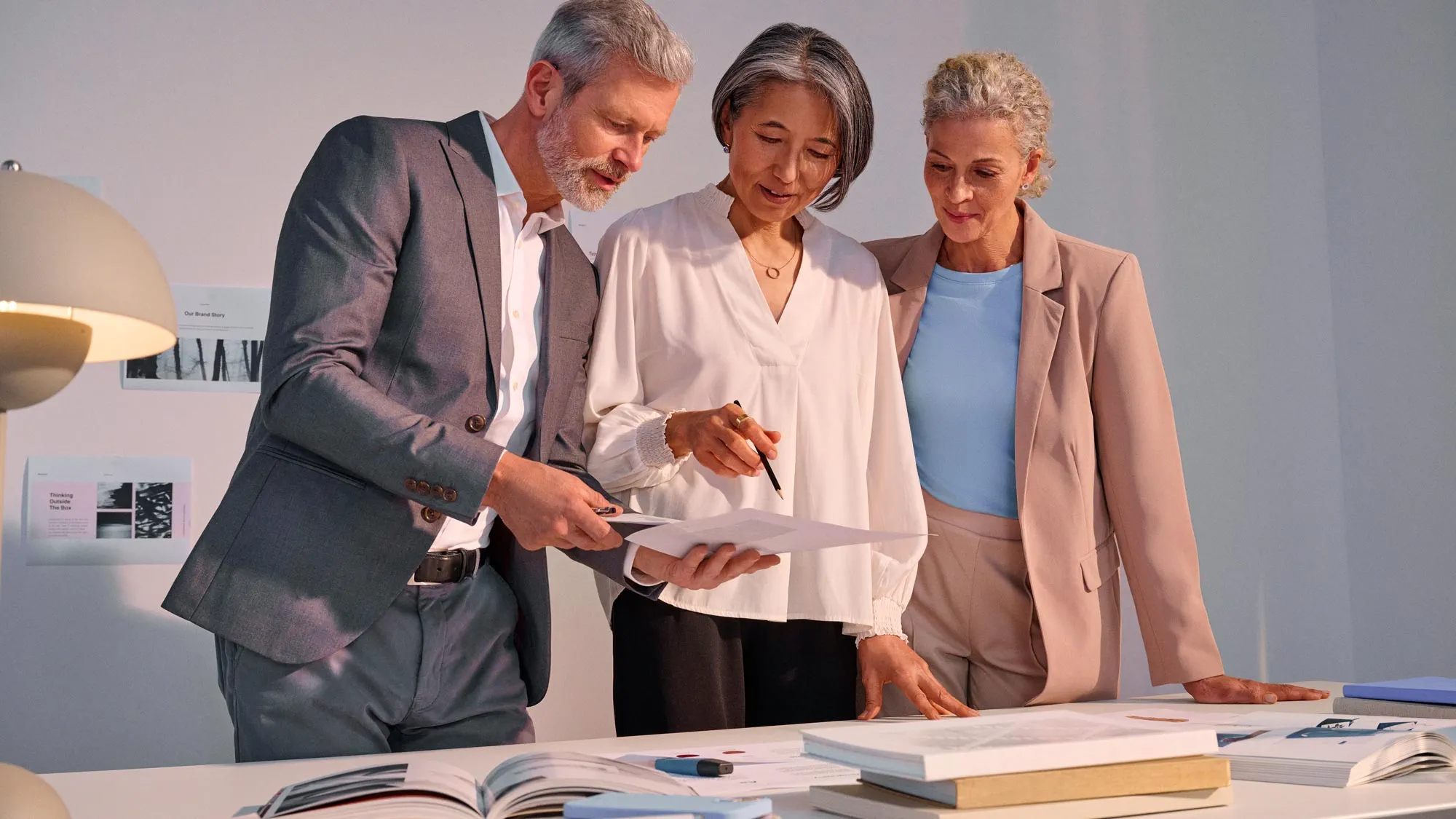 Group in a business meeting, actively participating while using hearing aids.