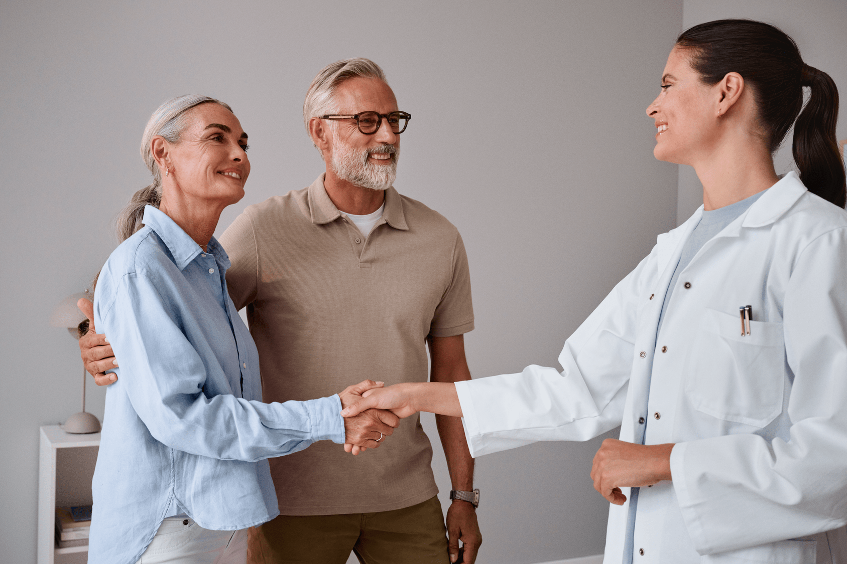 couple greeting audiologist