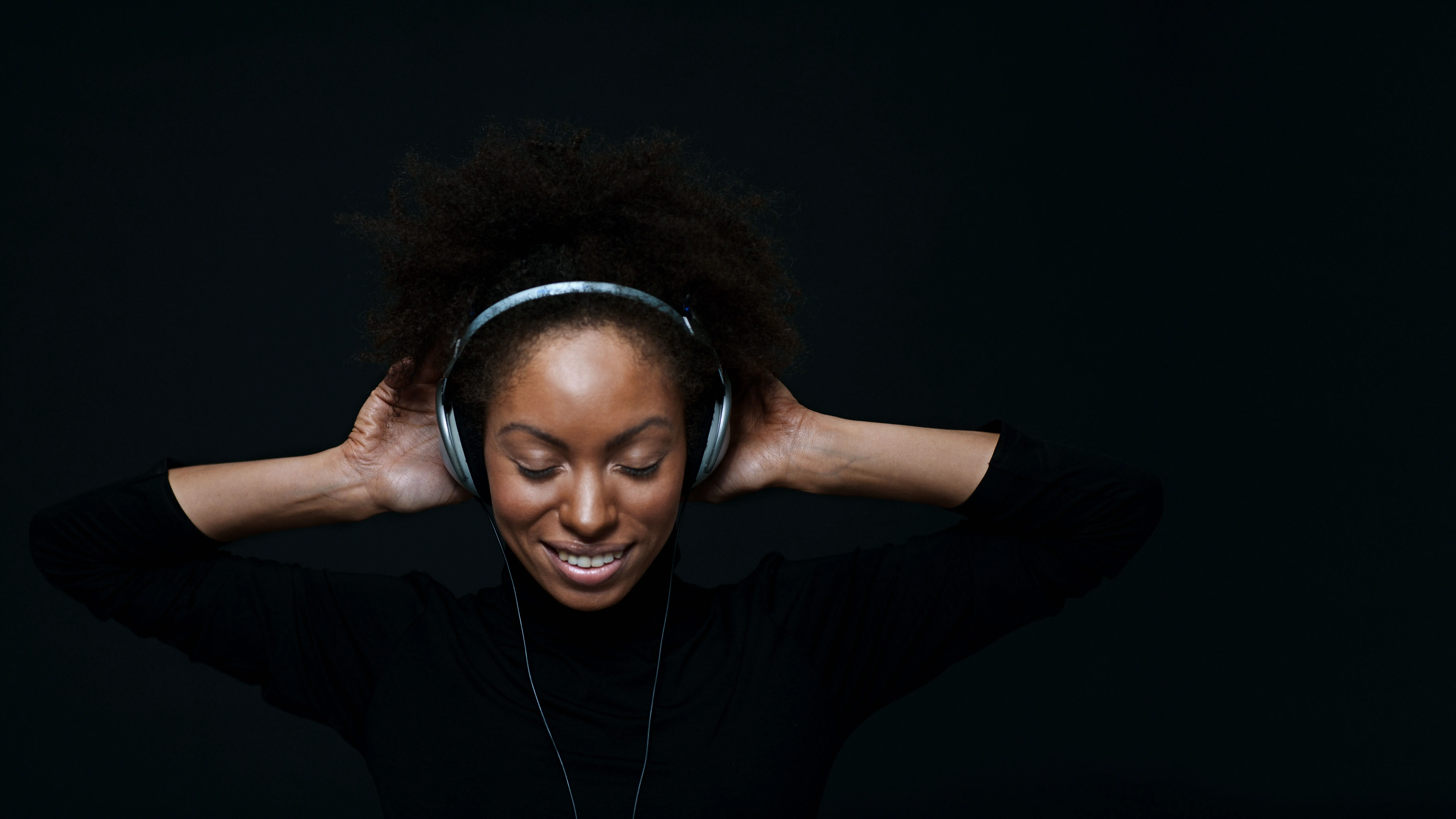 Woman listening to music risking hearing loss