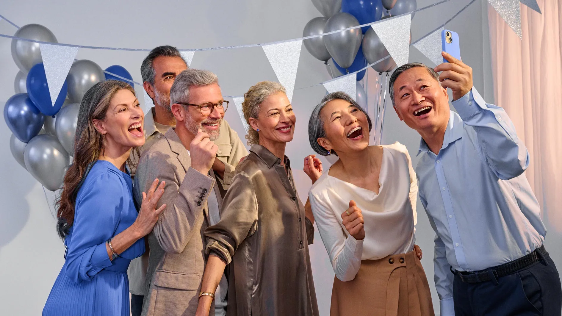 Enthusiastic friends celebrating, sharing in hearing improvement together.