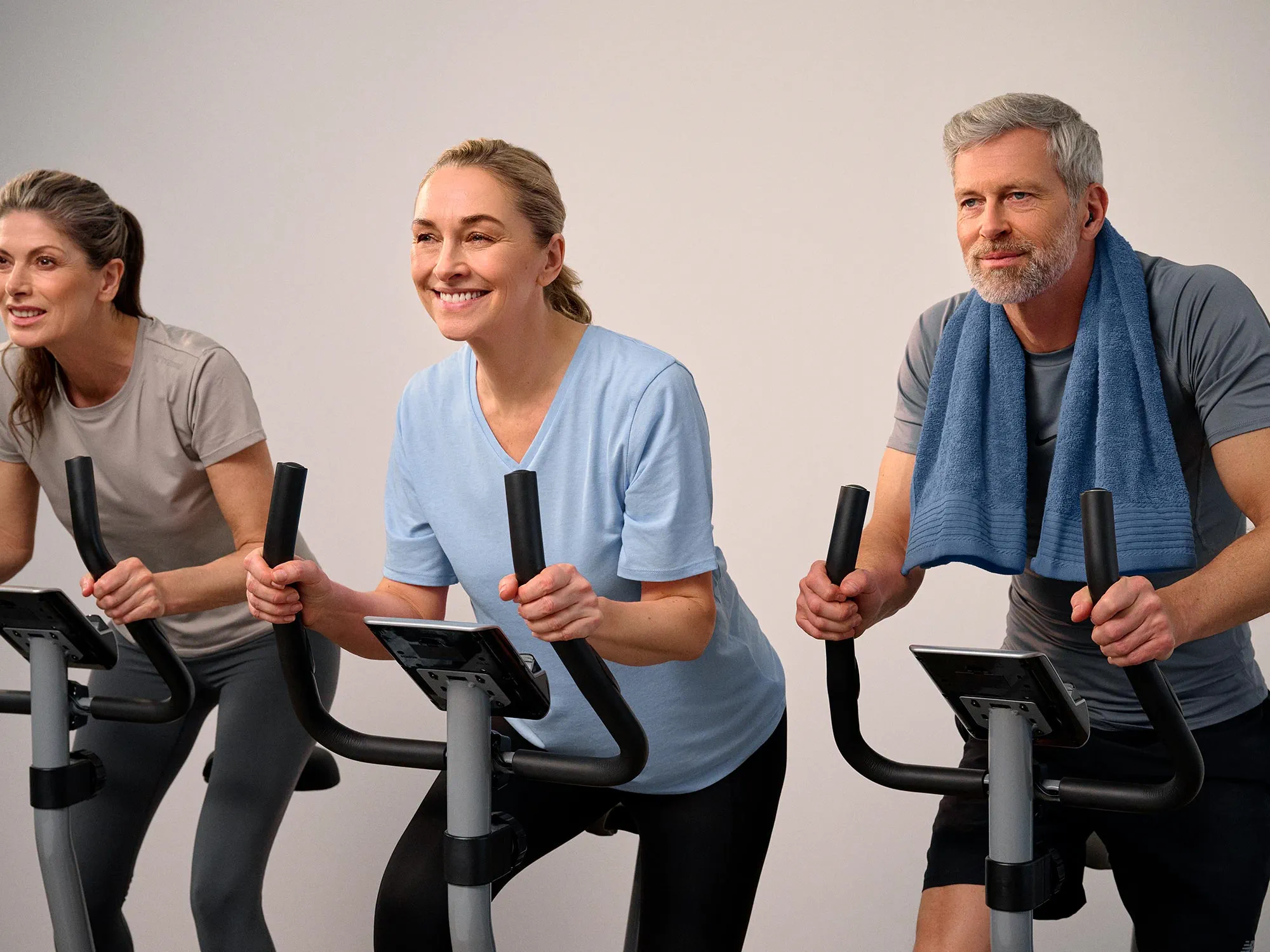 Group of friends in a biking class, all wearing hearing aids.