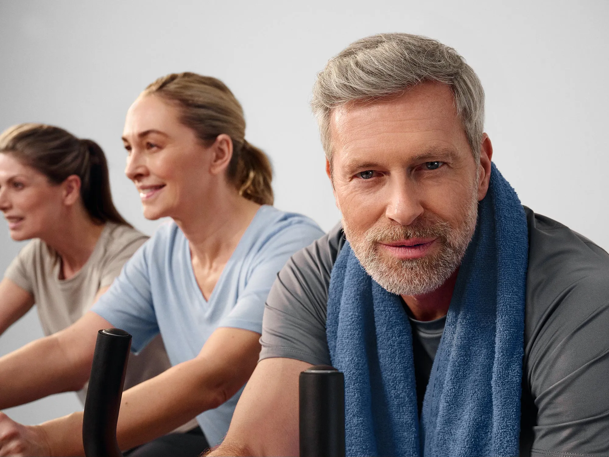 Active man looking ahead, wearing hearing aids.
