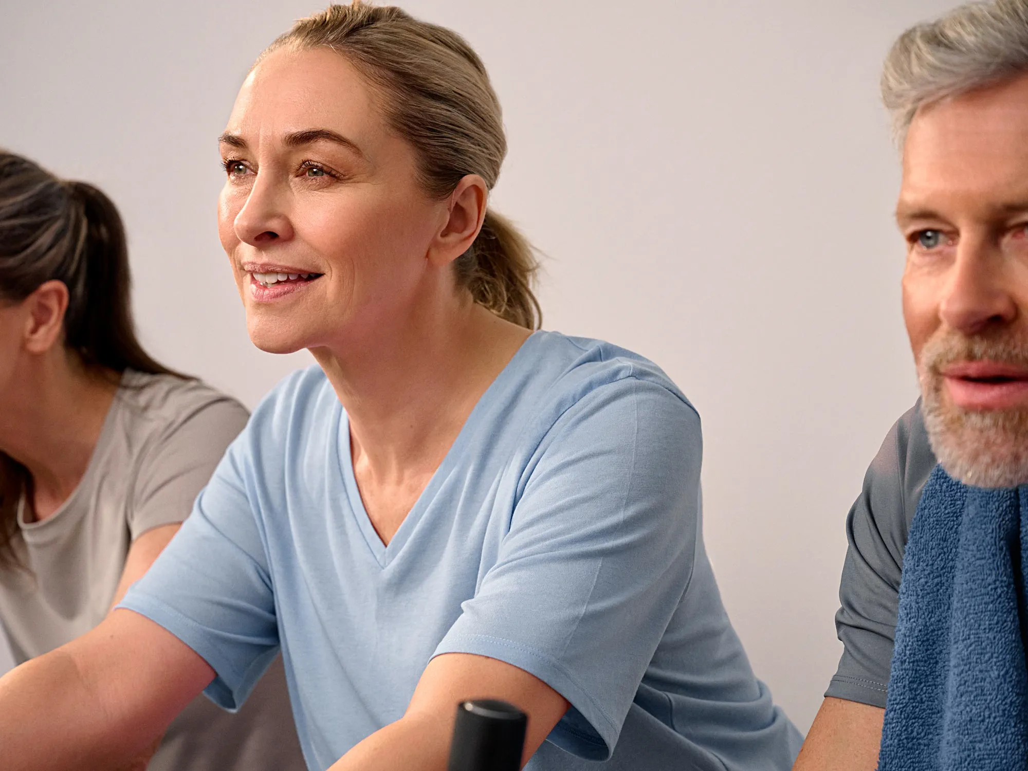 Active woman smiling with hearing aids, shown up close.