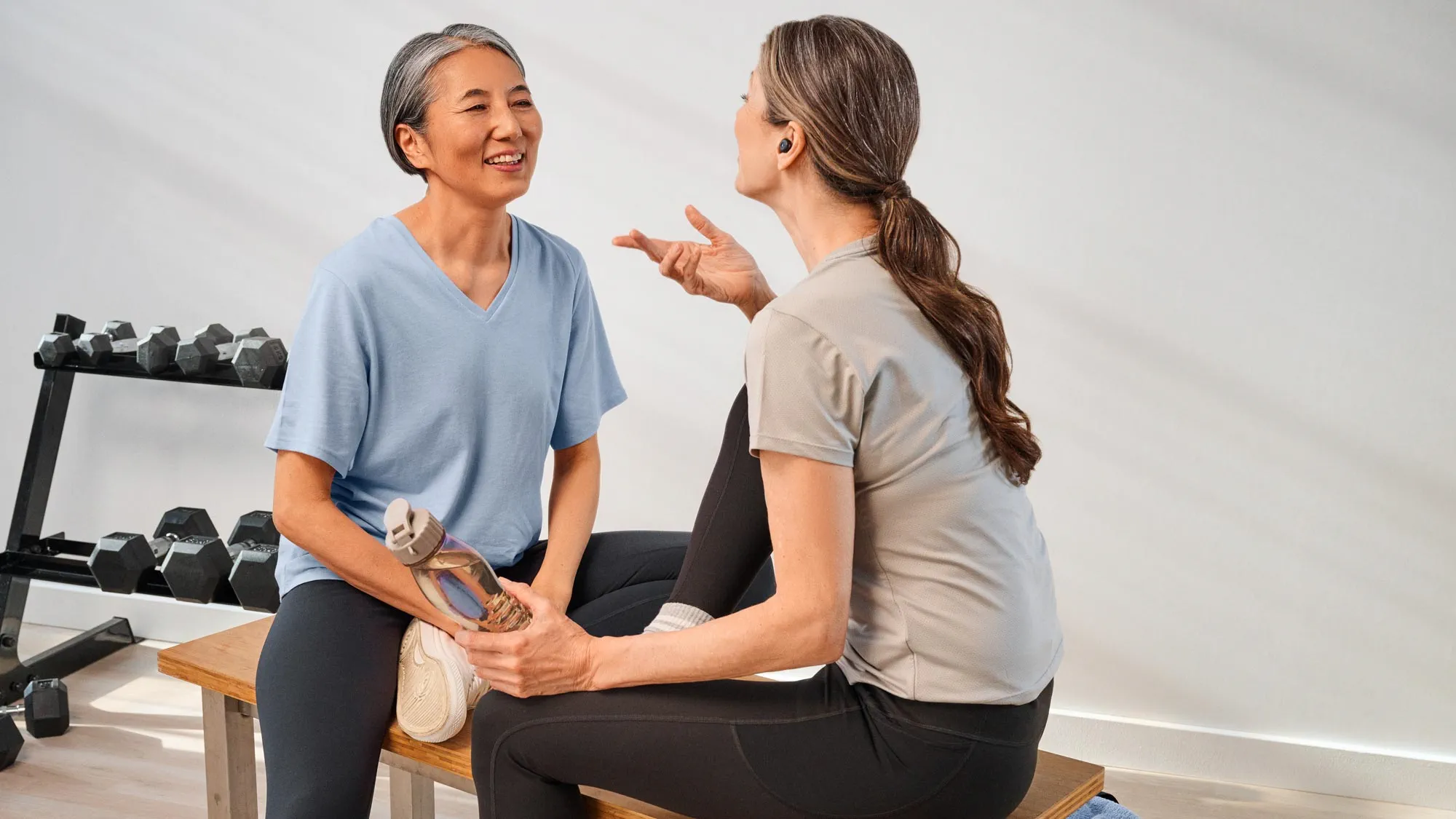 gym-friends-sitting-hearing-aids-4x3