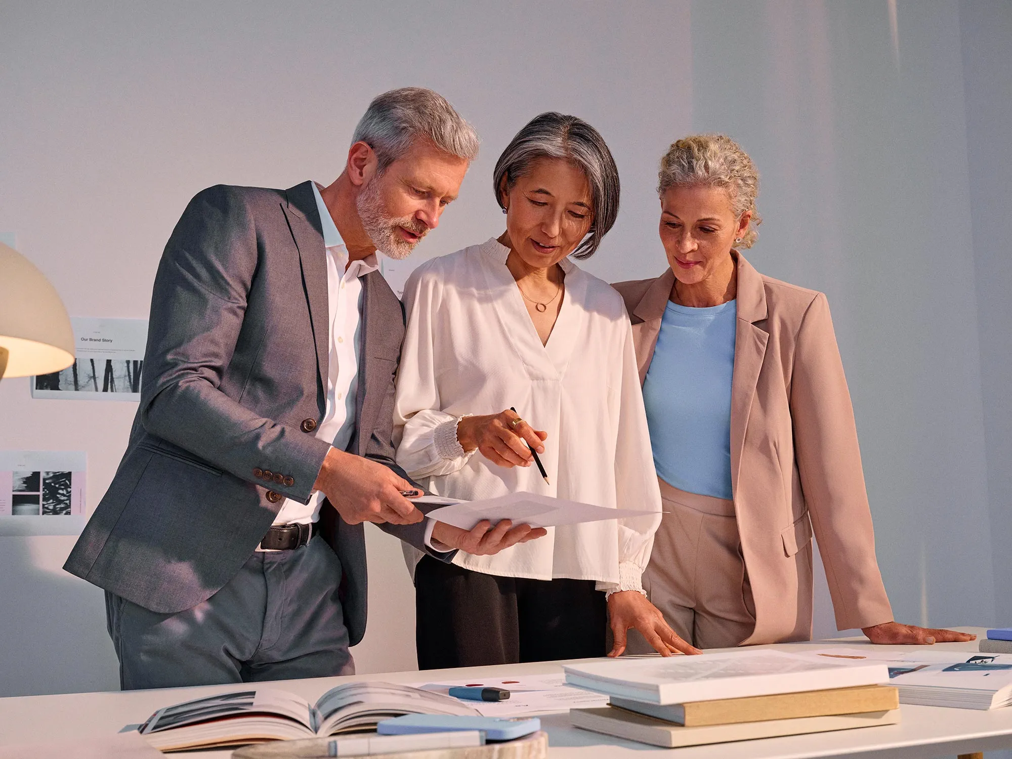 Group in a business meeting, actively participating while using hearing aids.