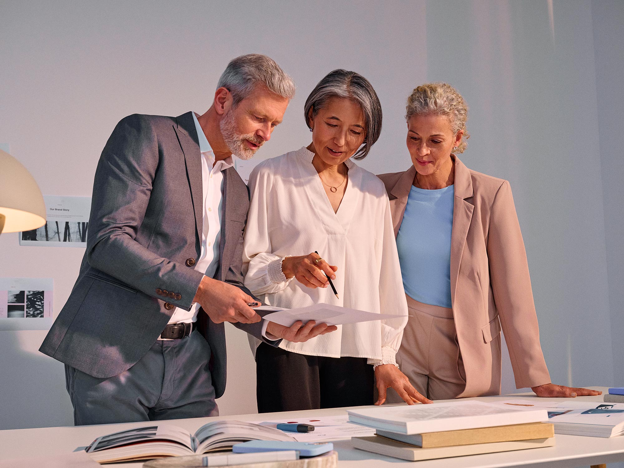 Group in a business meeting, actively participating while using hearing aids.