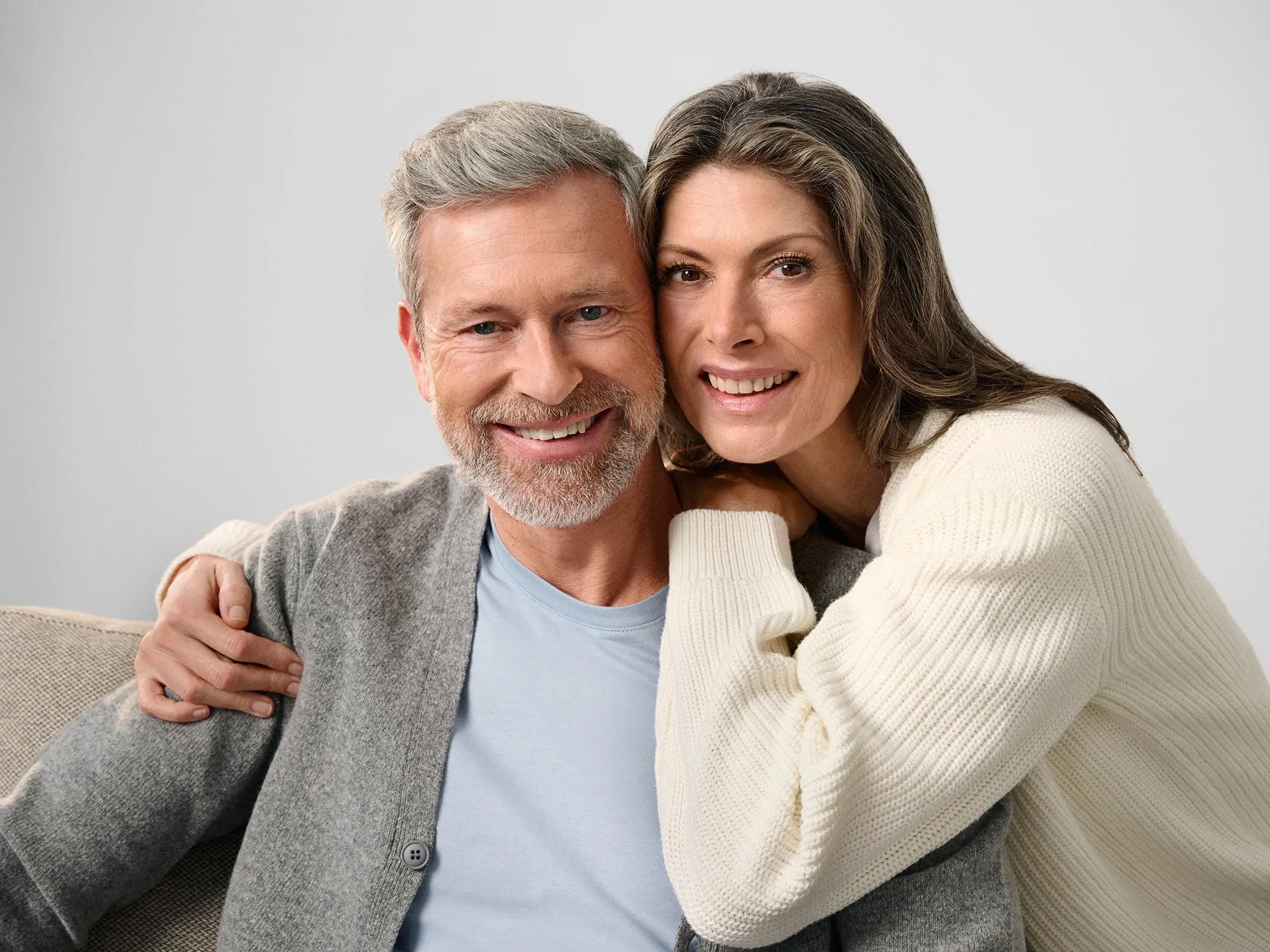 Couple staring together, discussing hearing loss.