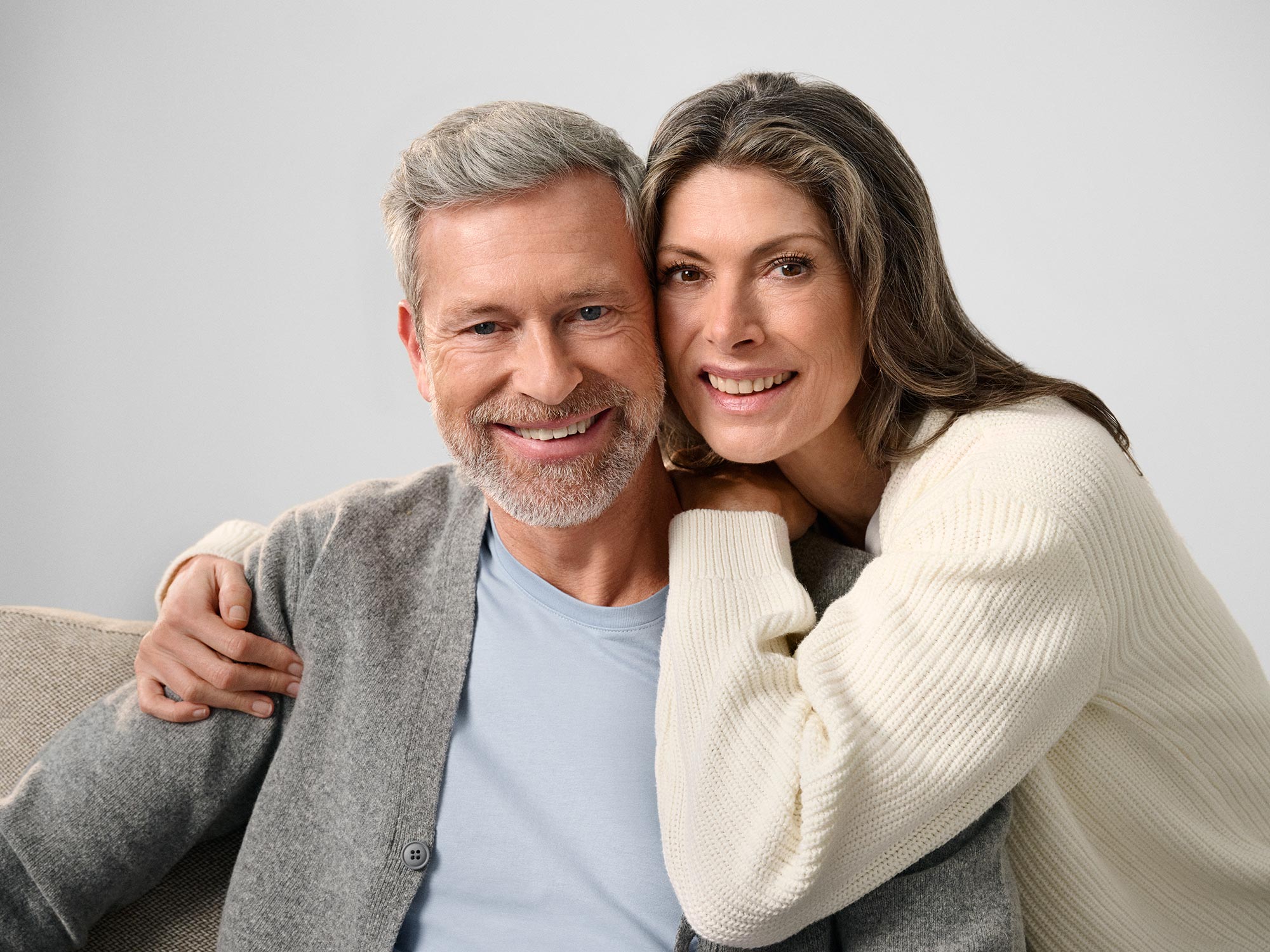 Couple staring together, discussing hearing loss.