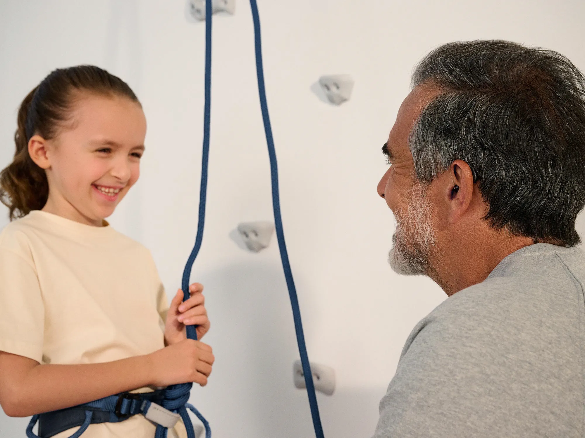 grandparent-talking-climbing-hearing-aids-4x3