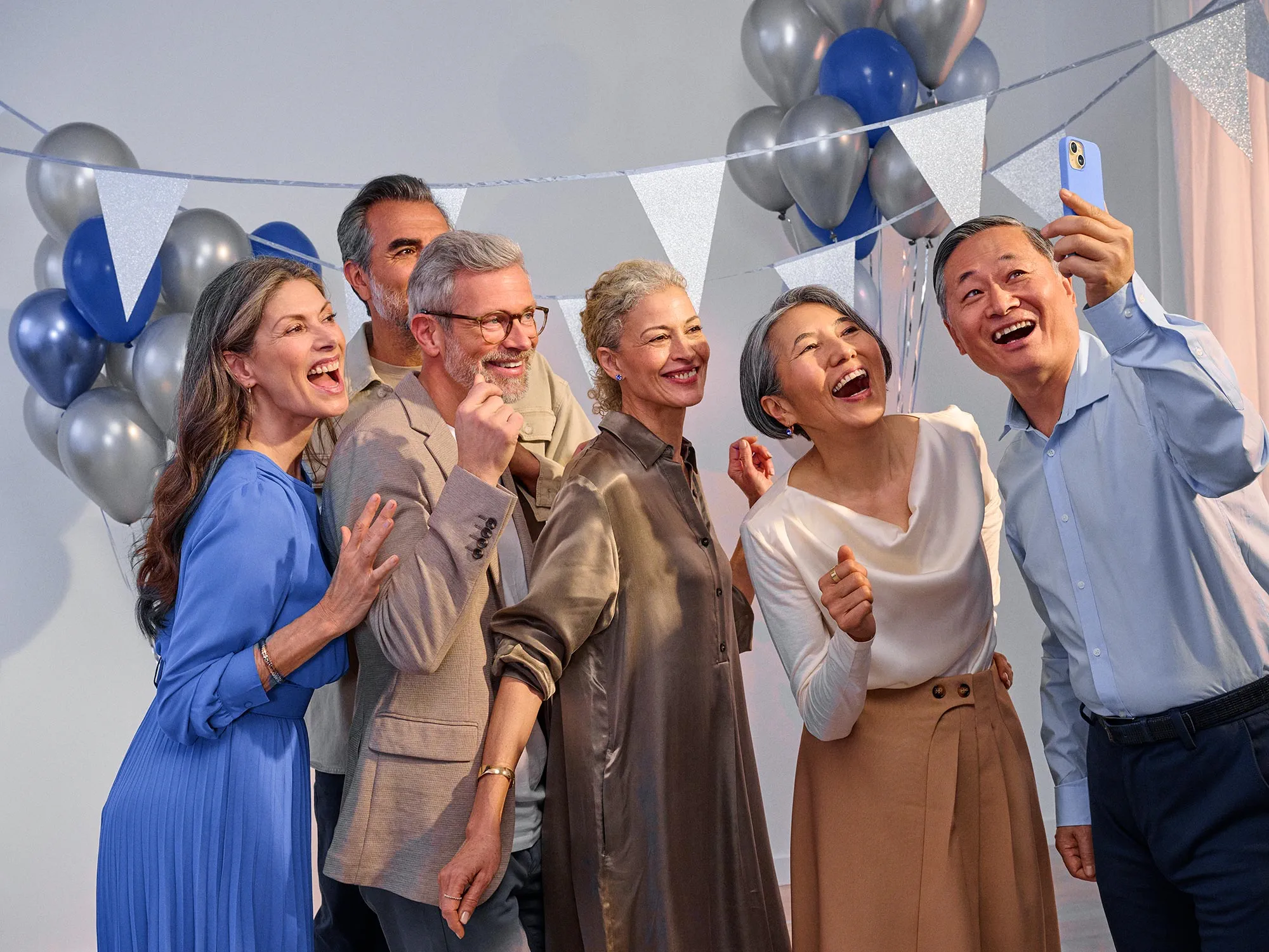 Enthusiastic friends celebrating, sharing in hearing improvement together.