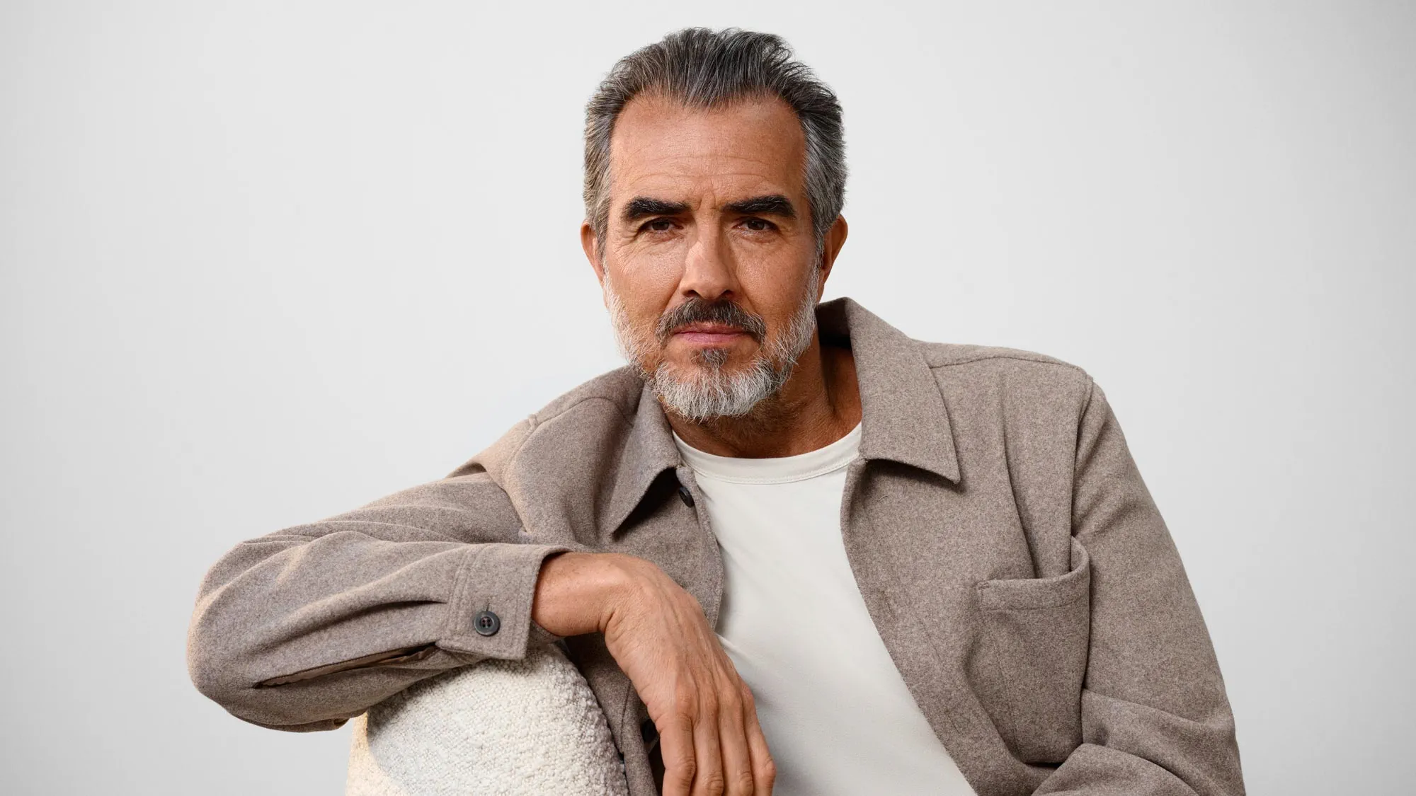 Serious man thinking about hearing loss.