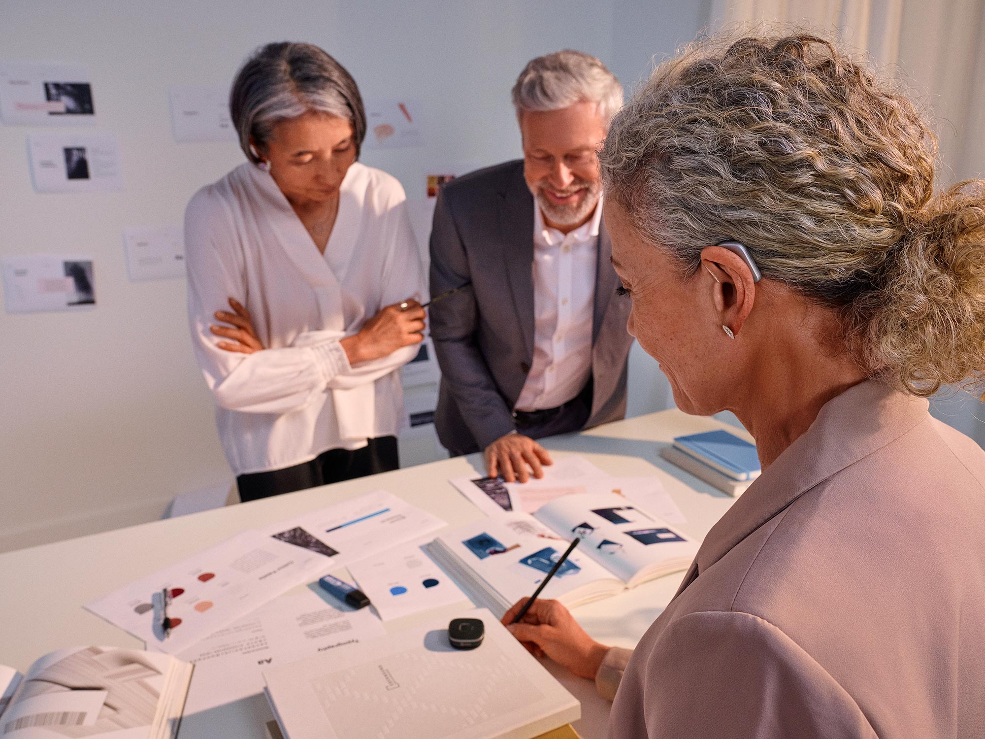 Work meeting planning session, using SoundAssist accessory.