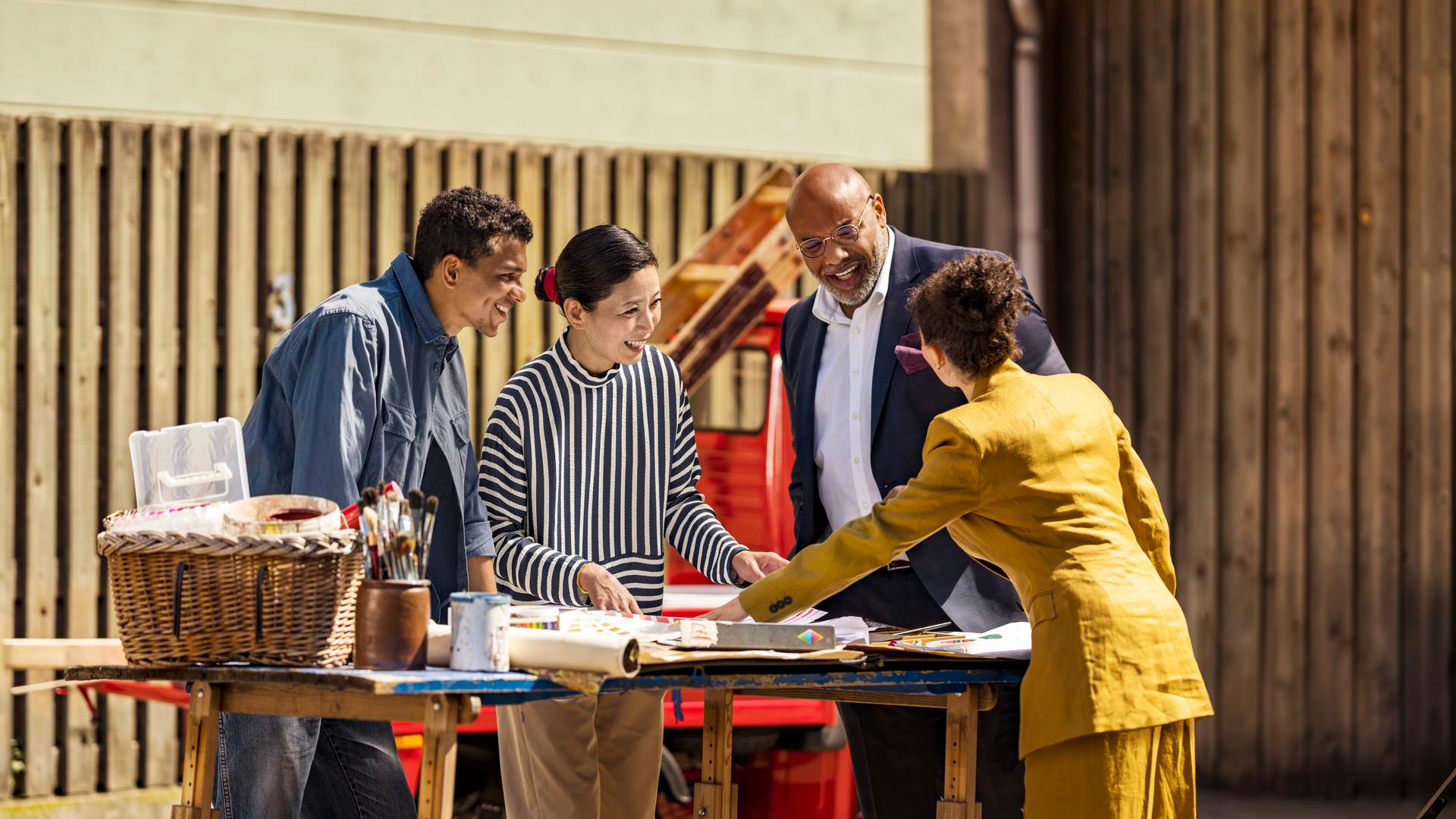 Group of people planning business thanks to Signia IX hearing aids. 