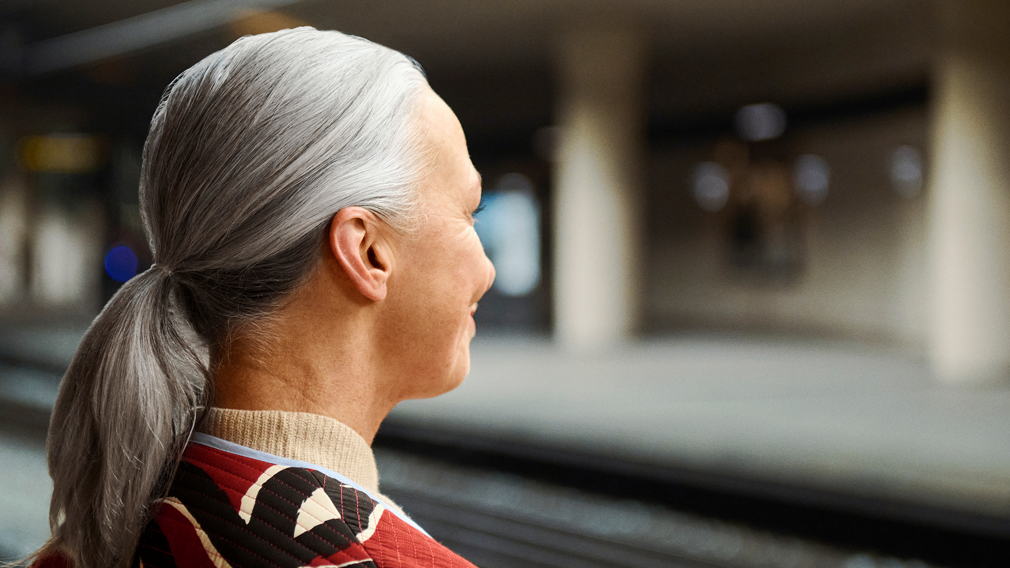 Signia Insio IX hearing aids seen in womans ear to show how invisible they are.