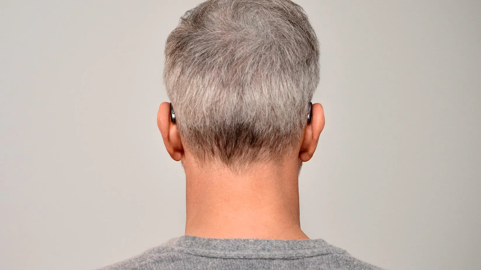 Seeing man from behind wearing Signia Pure hearing aids