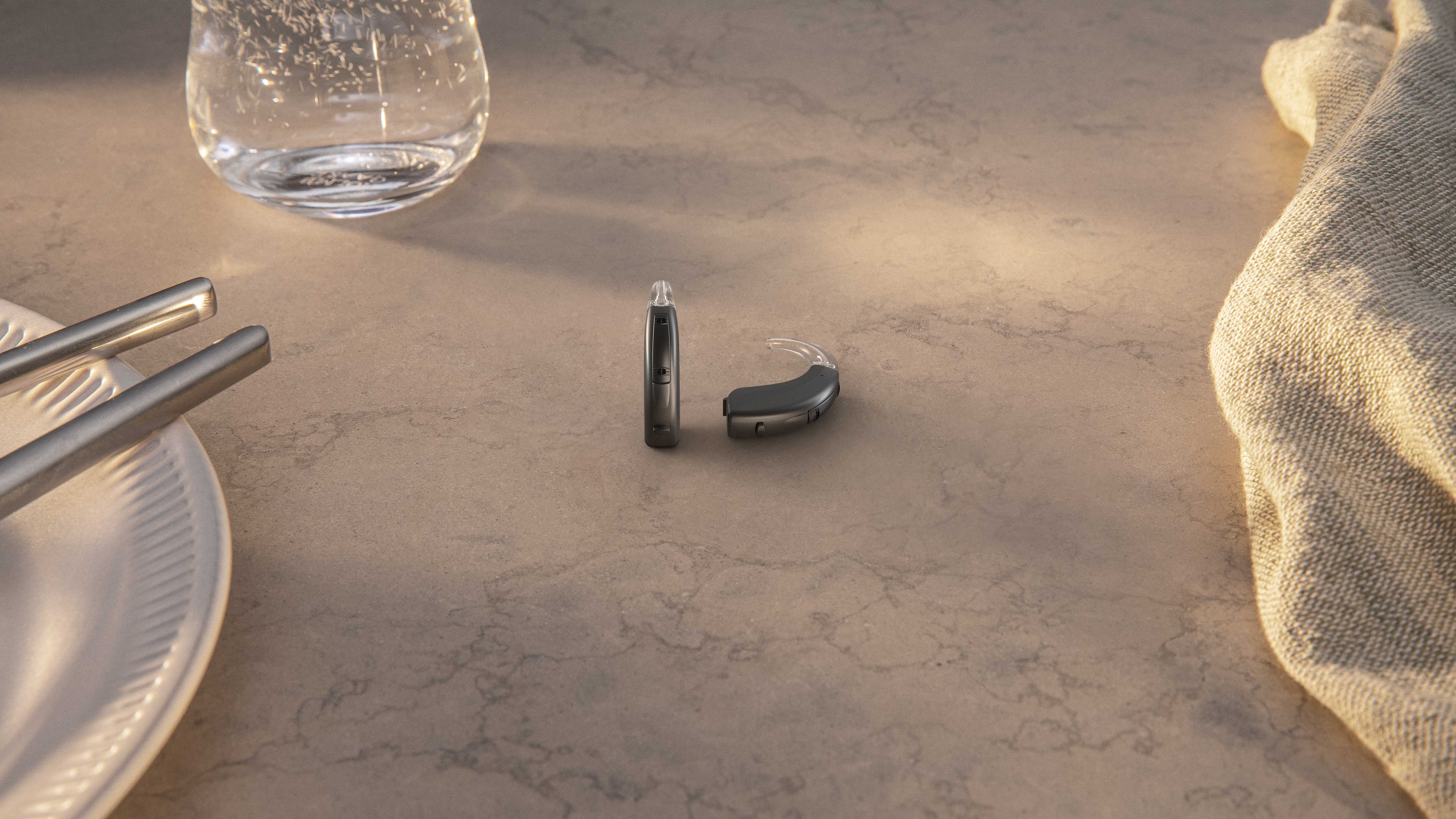 Widex behind the ear 312 represented in a home environment to show the true size of the hearing aid. 