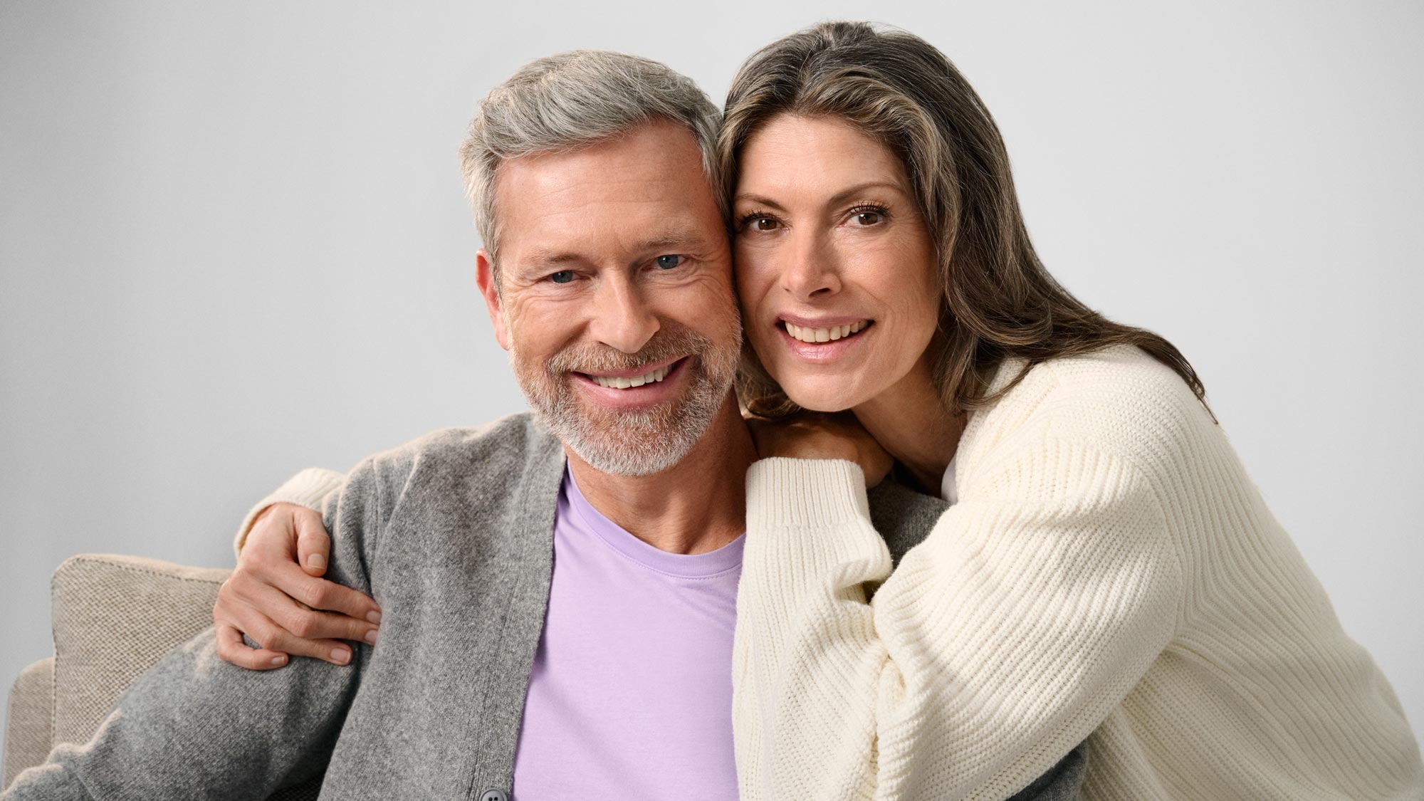 Couple staring together, discussing hearing loss.