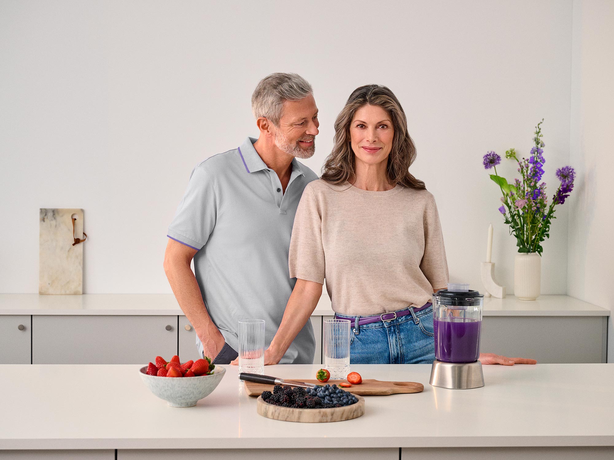 Strong woman in the kitchen, wearing hearing aids.