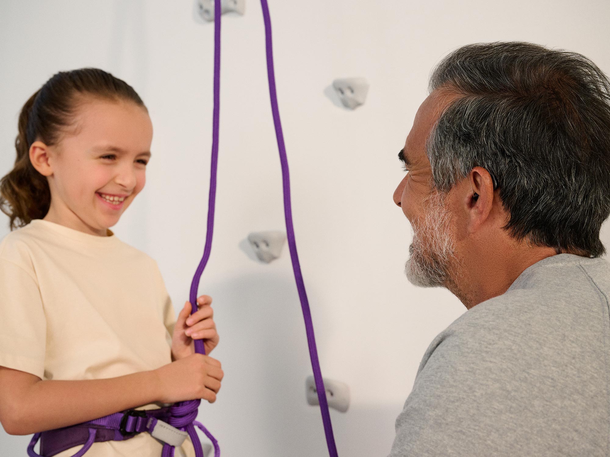 grandparent-talking-climbing-hearing-aids-4x3