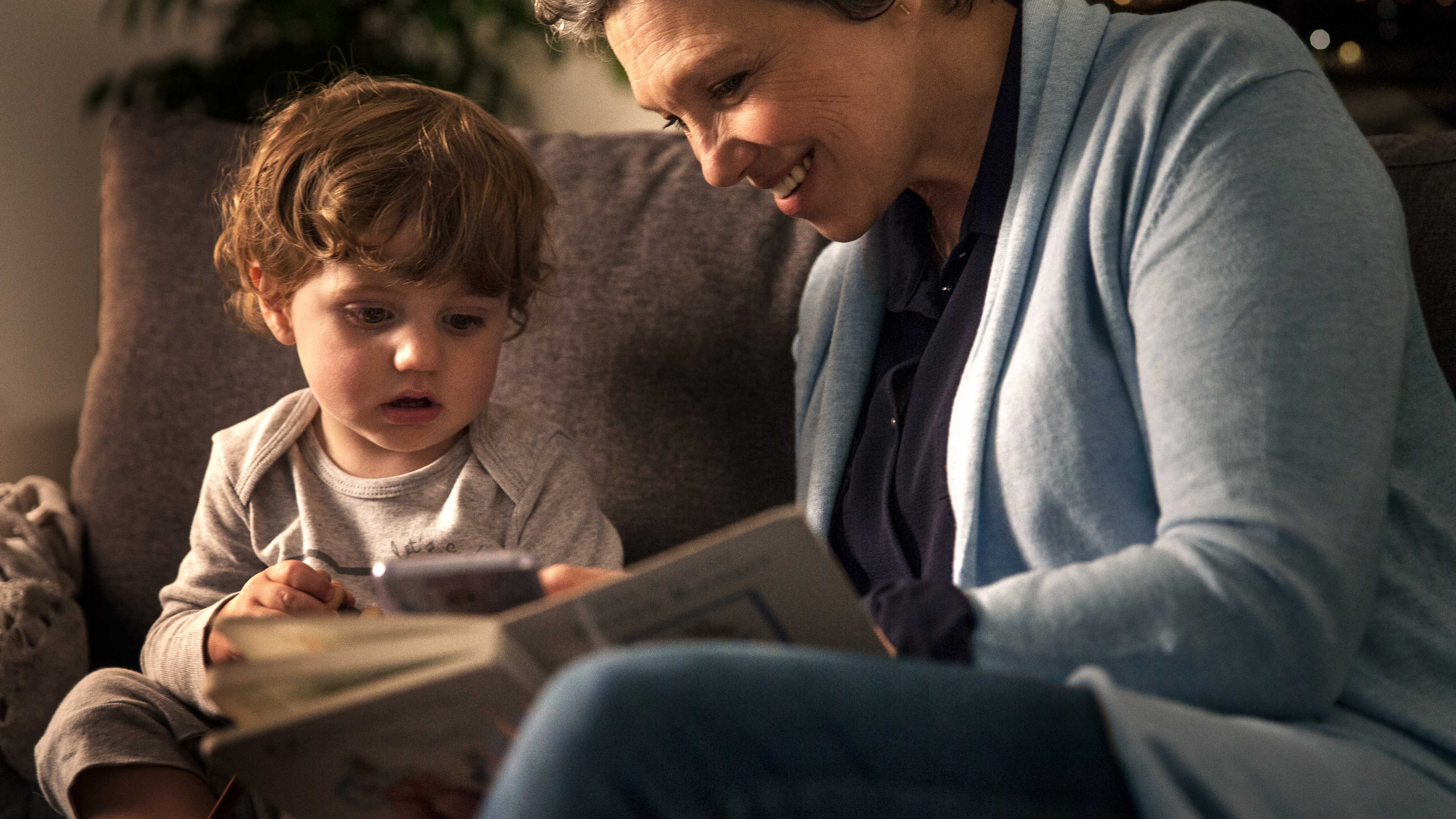 Woman and her grandchild, both having trouble hearing each other due to hearing loss.