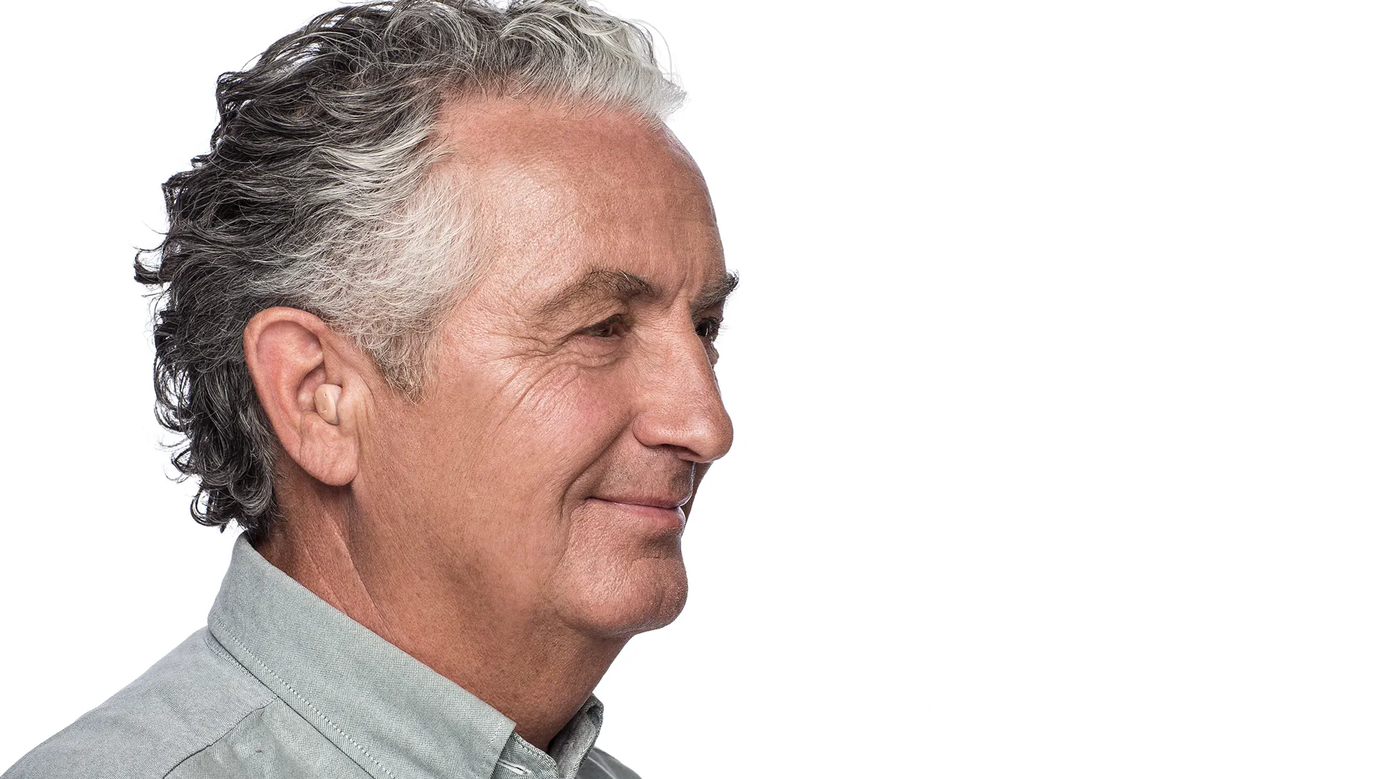 In the ear (ITE) hearing aid shown in the ear on man.