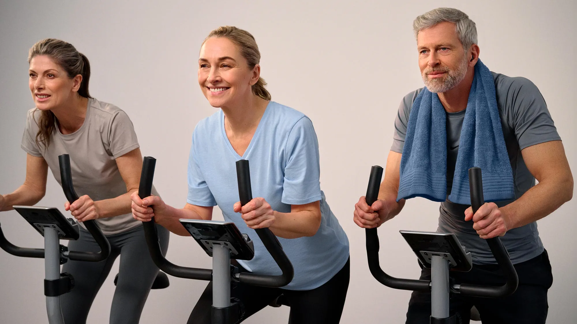 Group of friends in a biking class, all wearing hearing aids.