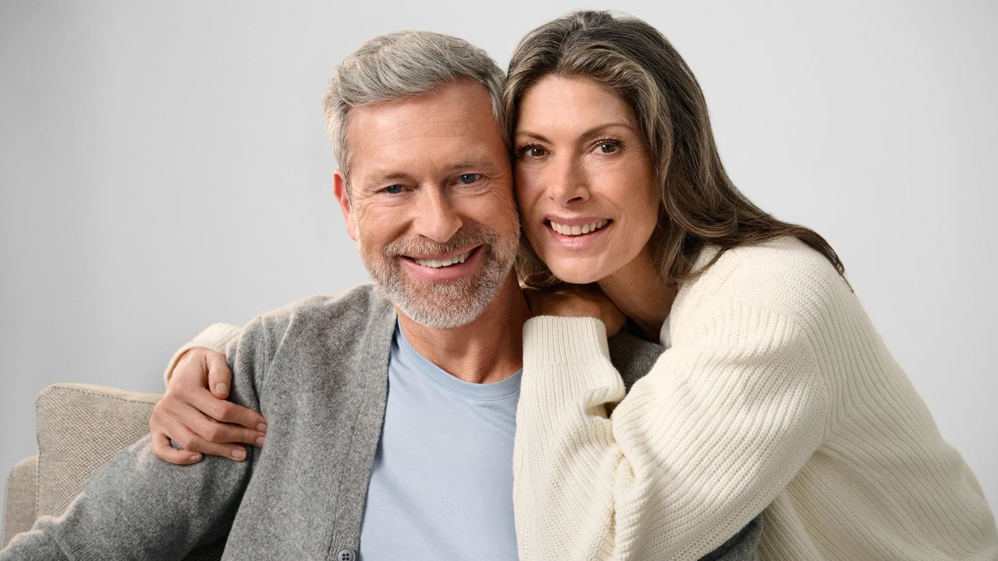 Couple staring together, discussing hearing loss.